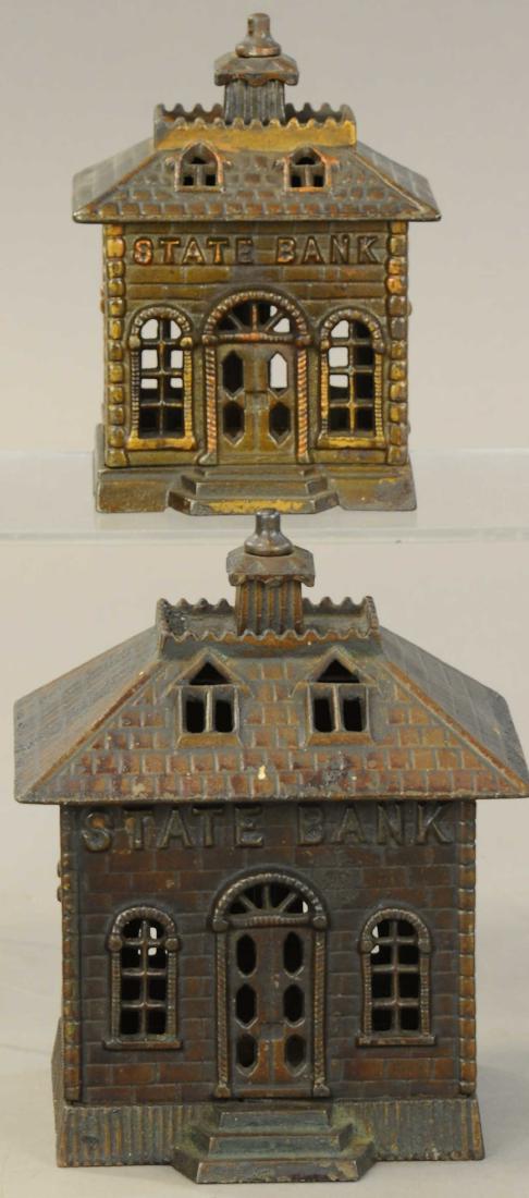 TWO SIZED KENTON STATE STILL BANKS: 1173. TWO SIZED KENTON STATE STILL BANKS | Lot includes a Medium state bank w/ fixed door and a large state bank w/ fixed door. | 5.5" - 7" h. | All Original Condition. | $150 - $300