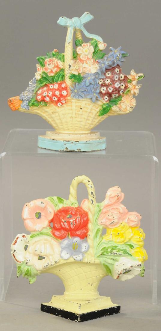 PAIR OF HUBLEY FLOWER DOORSTOPS: 1239. PAIR OF HUBLEY FLOWER DOORSTOPS | Both 7.25" h. | $100 - $200