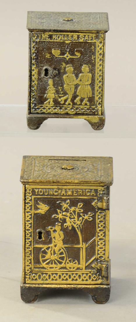 PAIR OF SAFE BANKS: 1260. PAIR OF SAFE BANKS | Lot includes an unusual pin variation of the young America safe along with a roller safe, both in exceptional condition. | 3.25" - 4.25" h. | All Original Condition. | $200 