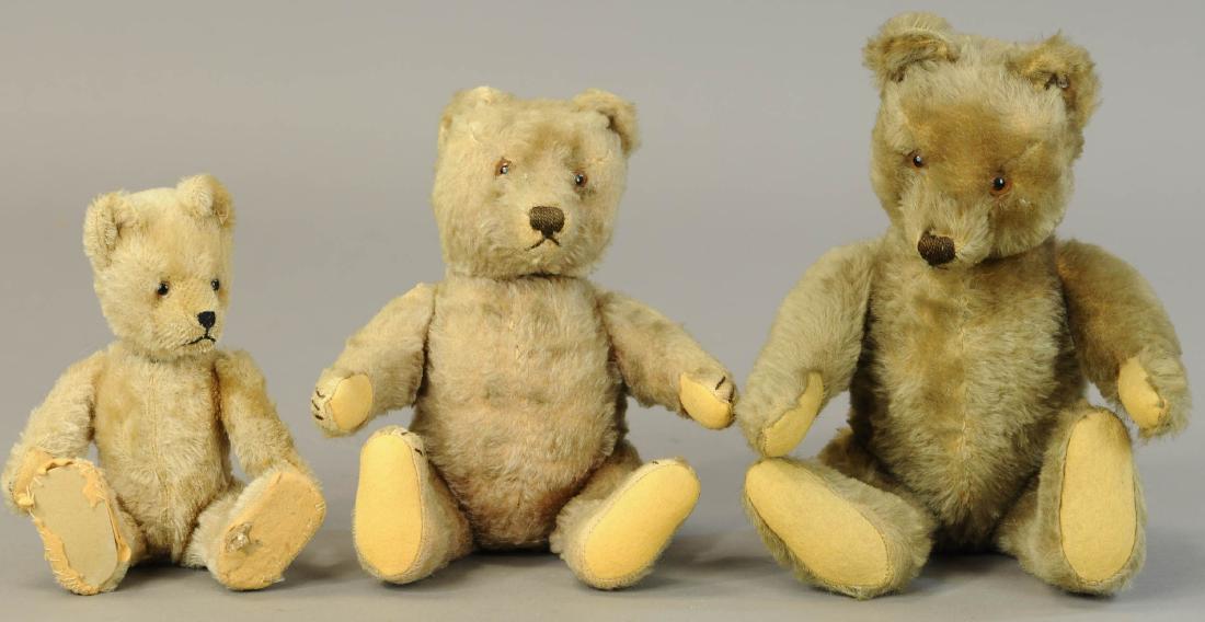 LOT OF THREE STEIFF BEARS: 1324. LOT OF THREE STEIFF BEARS | Largest Steiff bear w/button. | 7"-16" | Some hair lose, rough pads on smallest bear, Yes/no is inoperative. | $150 - $300