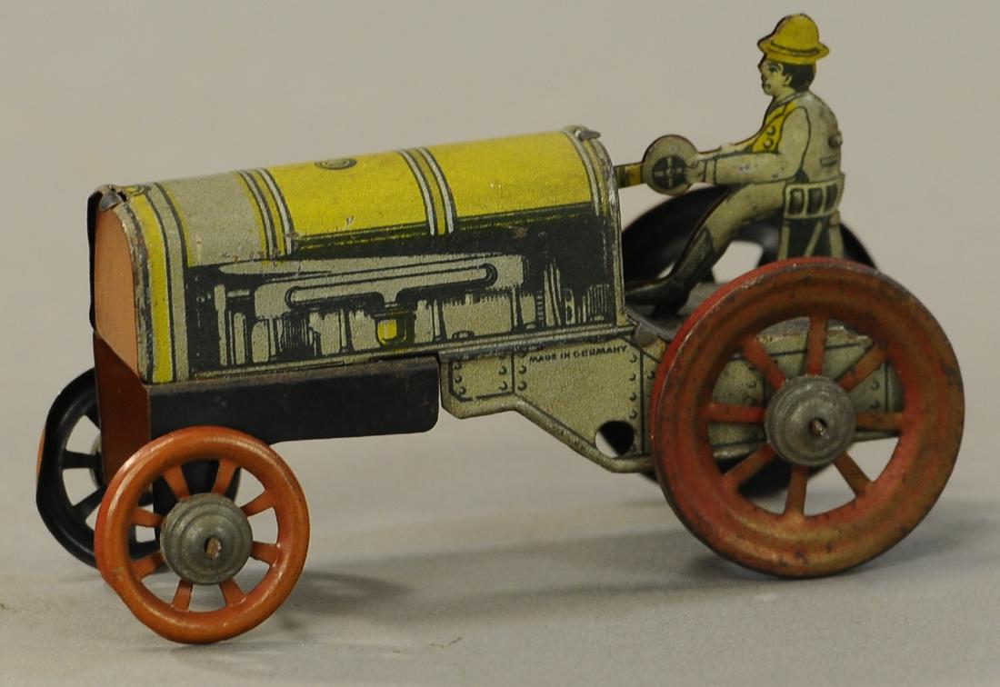 DISTLER TRACTOR PENNY TOY: 83. DISTLER TRACTOR PENNY TOY | 4" l. | All Original Condition. | $200 - $400