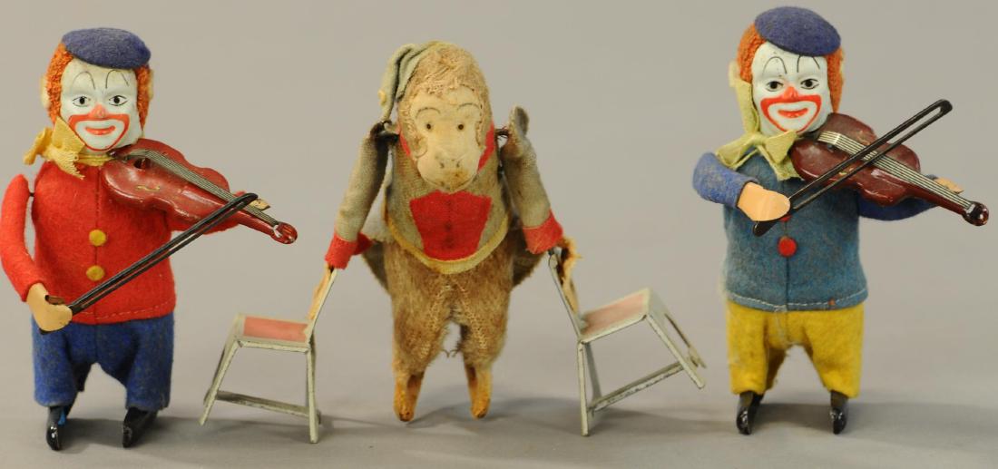 SCHUCO CLOWN MUSICIANS W/ PERFORMING MONKEY: 103. SCHUCO CLOWN MUSICIANS W/ PERFORMING MONKEY | Monkey is likely German or Japanese, but not marked Schuco. | 5.5" w. | All Original Condition. | $200 - $400