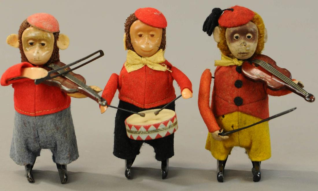 THREE SCHUCO MONKEY MUSICIANS: 104. THREE SCHUCO MONKEY MUSICIANS | 5" h. | Monkey w/ grey pants has broken spring, otherwise in All Original Condition. | $200 - $400