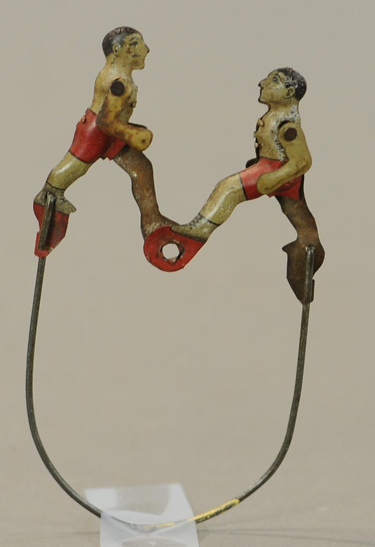 DUELING BOXERS SQUEEZE PENNY TOY: 114. DUELING BOXERS SQUEEZE PENNY TOY | 4" h. | All Original Condition. | $75 - $150