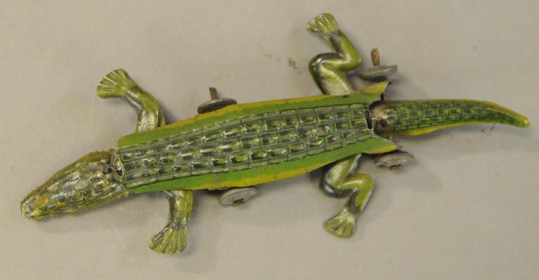 CRAWLING ALLIGATOR PENNY TOY: 119. CRAWLING ALLIGATOR PENNY TOY | 4" h. | All Original Condition. | $75 - $150
