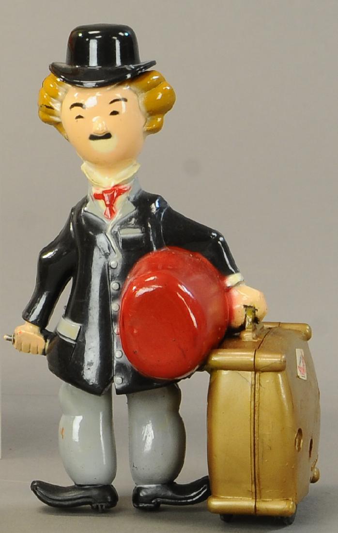 JUGUETES ROMAN SPAIN CHARLIE CHAPLIN WIND-UP: 239. JUGUETES ROMAN SPAIN CHARLIE CHAPLIN WIND-UP | 6.5" | Hat and suitcase are glued on possibly by factory, All Original Condition. | $75 - $150