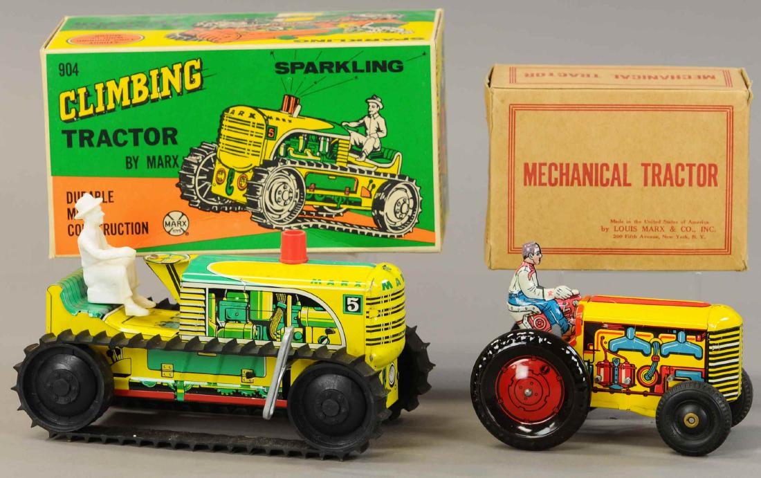 PAIR OF BOXED MARX TRACTORS: 264. PAIR OF BOXED MARX TRACTORS | 8" l. | All Original Condition. | $150 - $300
