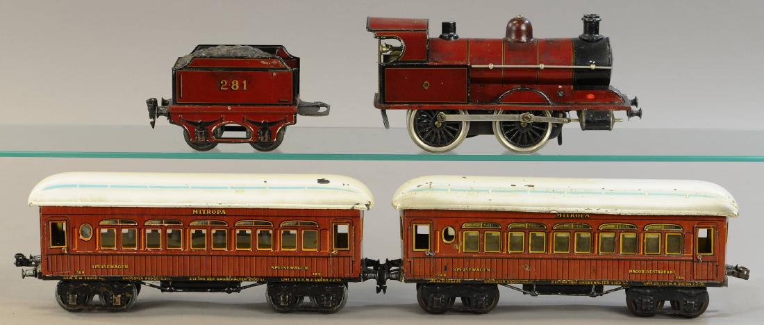 MARKLIN MR MITROPA SET: 396. MARKLIN MR MITROPA SET | 1 gauge, clockwork. | Loco & tender 16" l. | Loco and tender have touch-ups throughout, One car has replaced door handles, otherwise All Original Condition. | $300 - $600