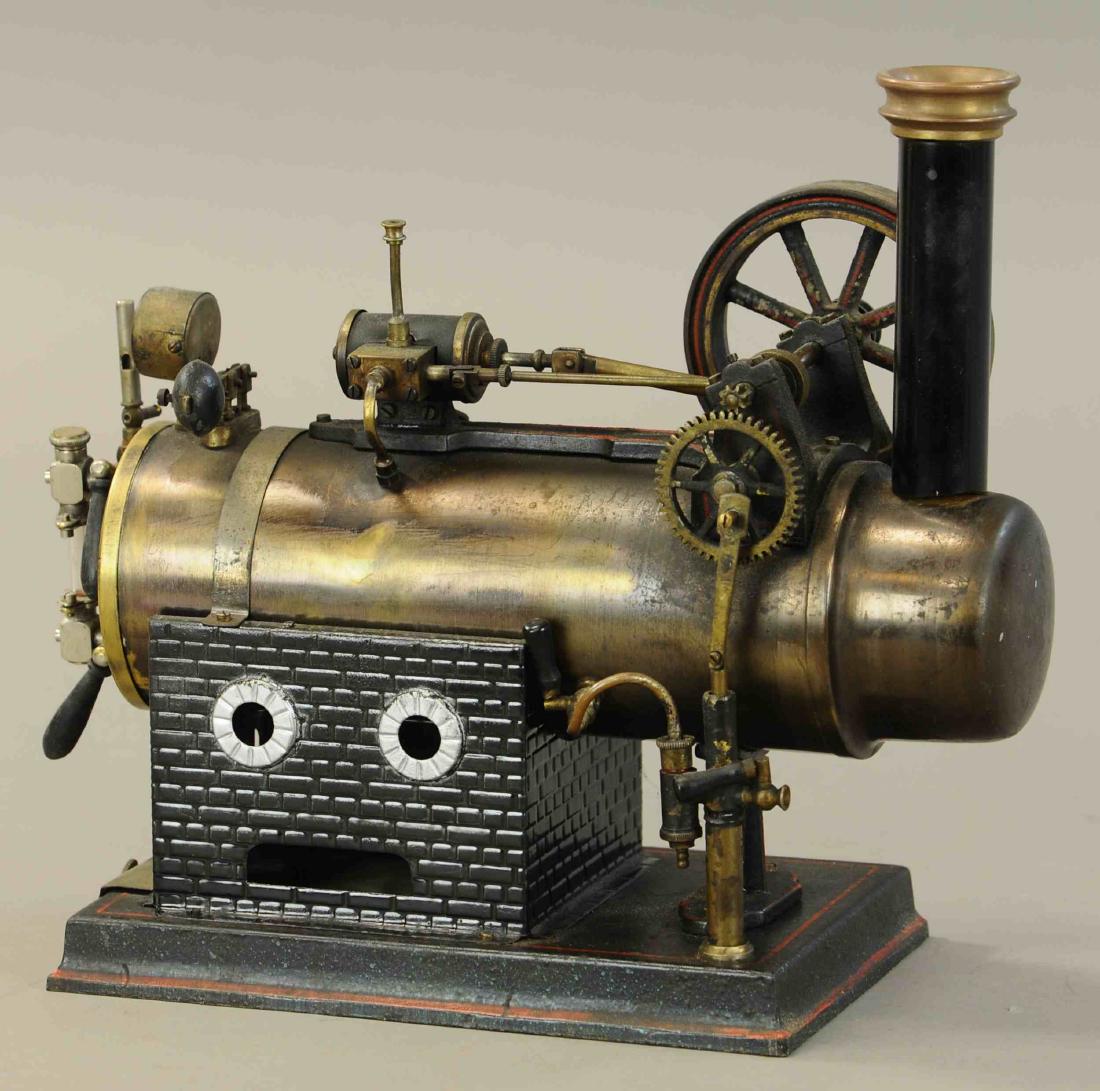 JF JON FALK LOCOMOBILE STEAM ENGINE: 443. JF JON FALK LOCOMOBILE STEAM ENGINE | circa 1914, original condition, complete with burner and stack, box and paperwork. | Base 8" x 5" x 11" h. | All Original Condition. | $250 - $500