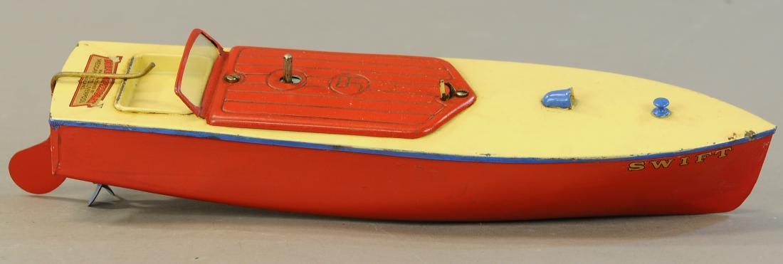 HORNBY WIND-UP SWIFT SPEEDBOAT: 449. HORNBY WIND-UP SWIFT SPEEDBOAT | 13.5" l. | Repaint to areas of red hull, clockwork functioning well. | $150 - $300