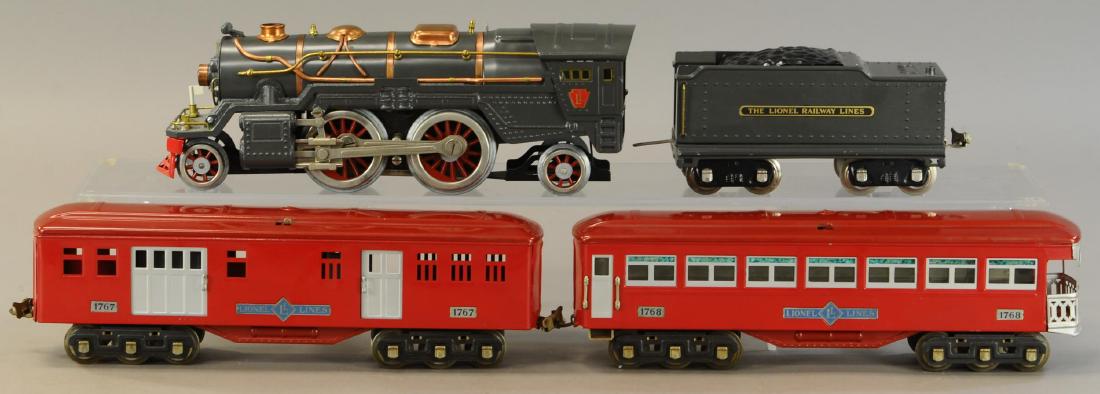 LIONEL 385E LOCOMOTIVE AND TWO CARS: 480. LIONEL 385E LOCOMOTIVE AND TWO CARS | Standard gauge, electric. | Loco & tender 24" | Restored. | $250 - $500