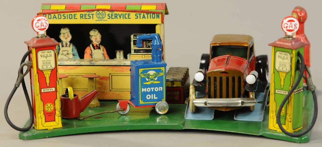 MARX ROADSIDE STATION W/ AUTO: 555. MARX ROADSIDE STATION W/ AUTO | Auto has electric headlights, version without wind-up motor. | 13.5" w. | As noted, lithography in All Original Condition on both. | $250 - $500