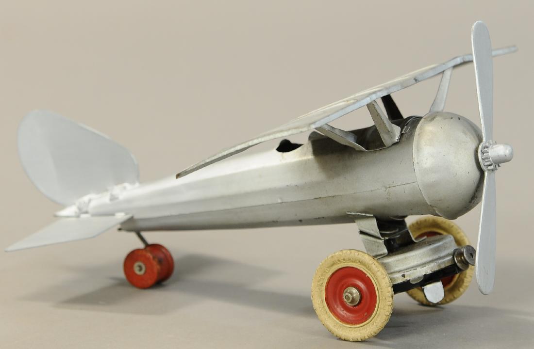 KINGSBURY MONOCOUPE AIRPLANE: 557. KINGSBURY MONOCOUPE AIRPLANE | 12" l. | Tail wing reattached and repainted around back of plane. | $100 - $200