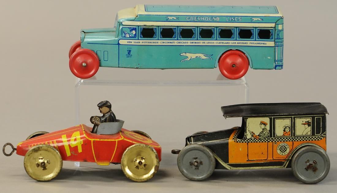 THREE CHEIN & MOHAWK TOYS AUTOS: 570. THREE CHEIN & MOHAWK TOYS AUTOS | Chein Greyhound bus has Provenance: Donald Kaufman Collection. Other two are made by Mohawk Toys. | 9" l. | All Original Condition. | $150 - $300