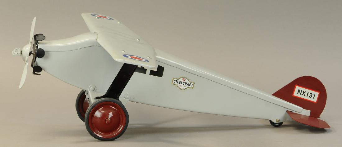STEELCRAFT NX 131 MONOCOUPE AIRPLANE: 635. STEELCRAFT NX 131 MONOCOUPE AIRPLANE | 24" l. | Restored. | $150 - $300