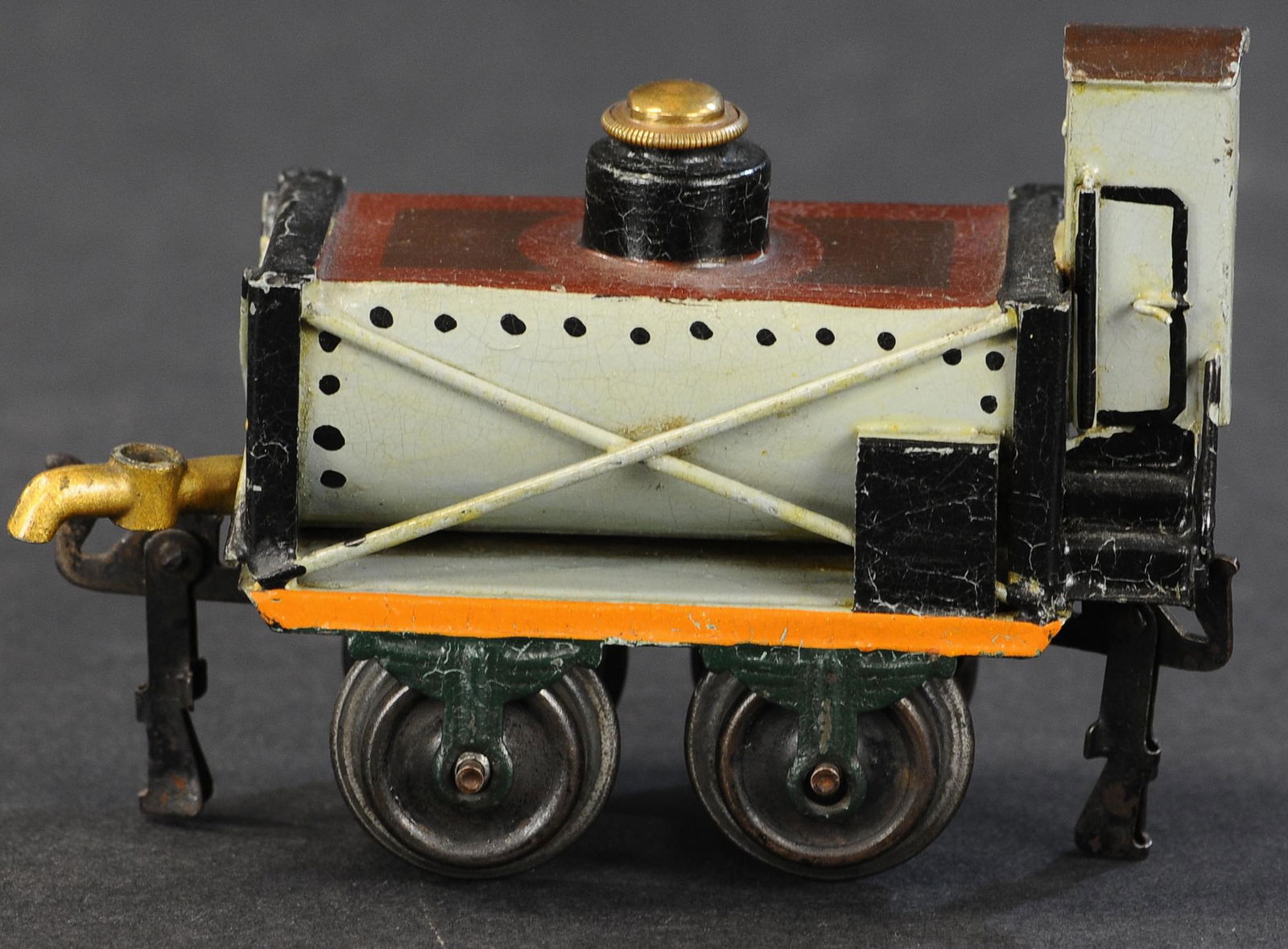 MARKLIN RARE PRR WATER TANK WAGON: 65. MARKLIN RARE PRR WATER TANK WAGON | Hand painted, Gauge 0, circa 1904, catalog #1826, rare water tank car with "PRR" marked on end below guards' house, spigot on the other end. | 4.5" length. | Mi