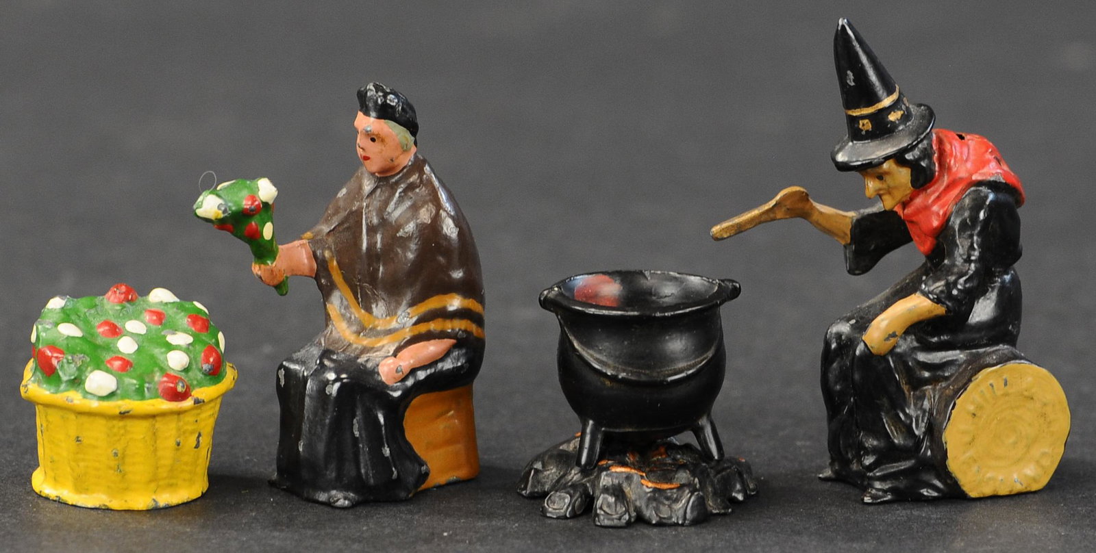 JOHILLCO WITCH W/CAULDRON & FLOWER SELLER: 94. JOHILLCO WITCH W/CAULDRON & FLOWER SELLER | Johillco witch w/cauldron and flower seller street vendor, British hollow cast, 4 pieces. | 54mm. | (Very Good Condition) | $400 - $600