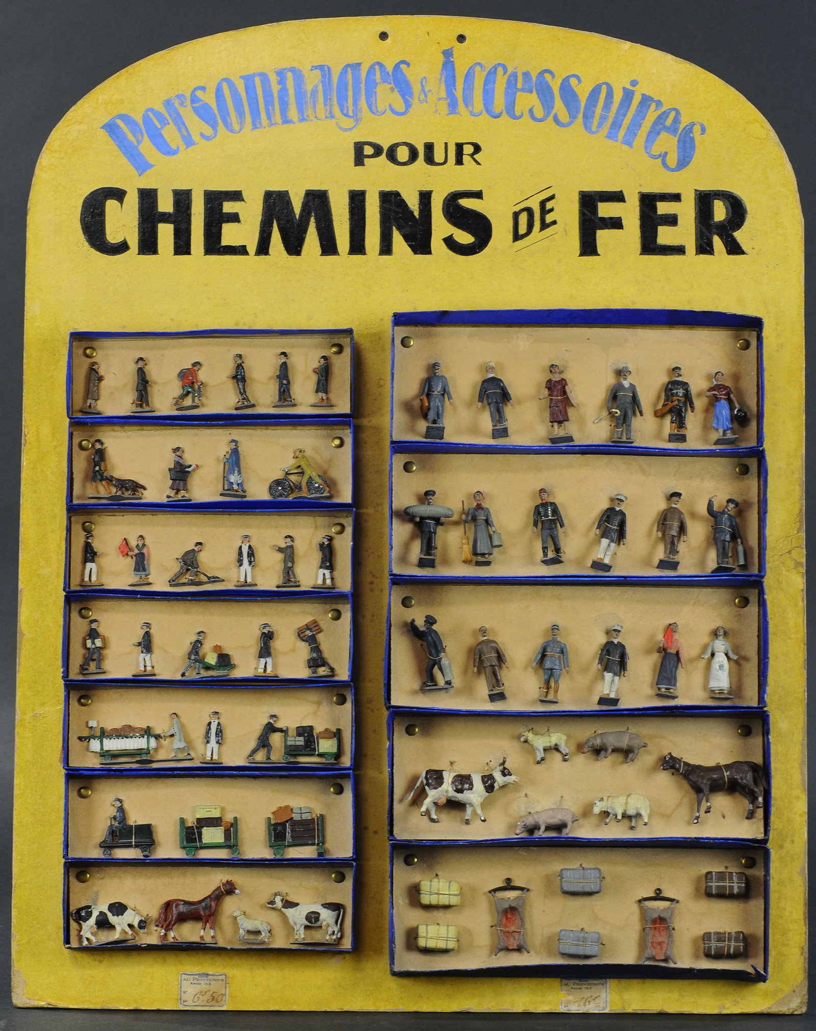 SALESMAN SAMPLE PRINTEMPS CBG STORE DISPLAY: 140. SALESMAN SAMPLE PRINTEMPS CBG STORE DISPLAY | Mignot display, 2 scales of boxed sets on original hand painted store display sets include farm and civilian railroad and livestock assortments. | 40