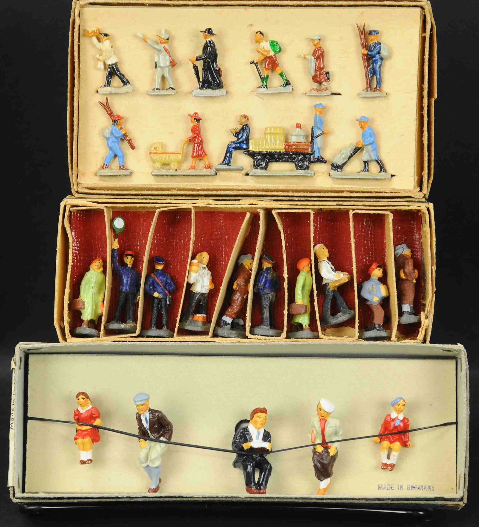 MARKLIN HO TRAIN FIGURES 404 GB: 144. MARKLIN HO TRAIN FIGURES 404 GB | Marklin O gauge & HO lead and composition figures, Trest HO composition figures, three boxed sets | Figures and boxes, (Near Mint Condition) | $200 - $400