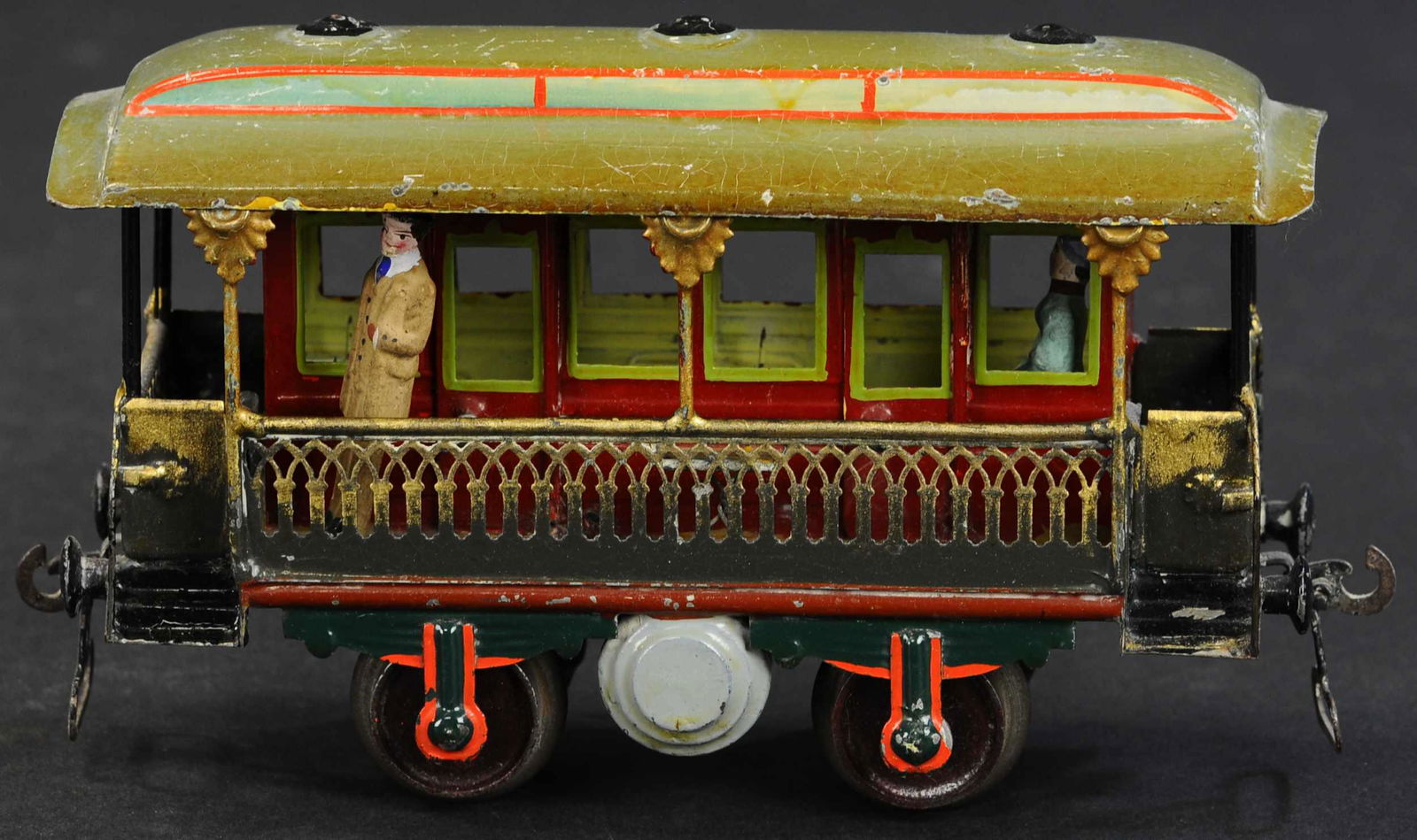 MARKLIN SWISS VERANDA CAR: 165. MARKLIN SWISS VERANDA CAR | Hand painted, Gauge 1, rare car with Swiss flag on side indicating that this belongs on the rails of Switzerland's scenic mountain railways, early car with cast iron w