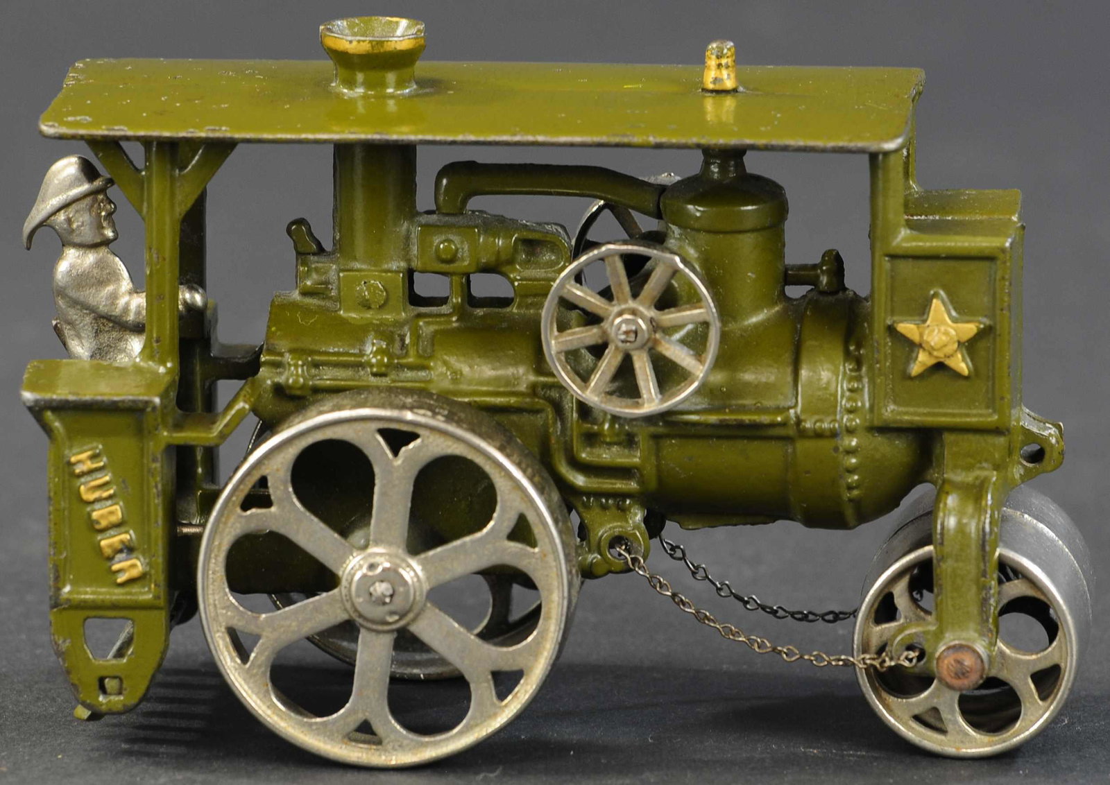 HUBLEY HUBER ROAD ROLLER: 273. HUBLEY HUBER ROAD ROLLER | Lancaster, Pennsylvania, circa 1920, green version with complete Hubley decal appearing at rear fender, original nickeled operator figure. | 7.75" length. | (Pristine t