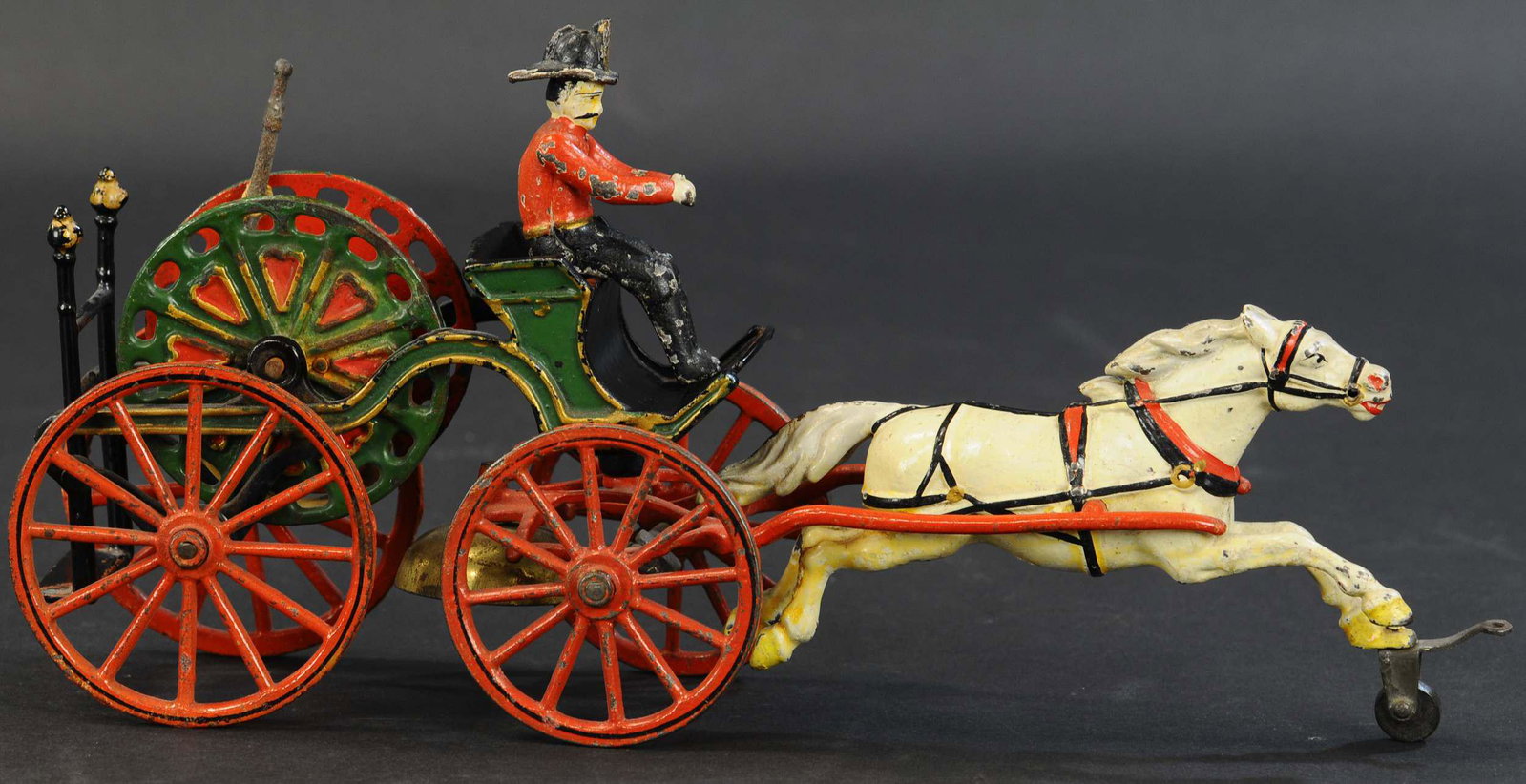 PRATT & LETCHWORTH HOSE REEL: 313. PRATT & LETCHWORTH HOSE REEL | Buffalo, New York, circa 1900, very attractive fire toy with solid multicolor hose reel. Unlike the other hose reel version offered, this example did not take a sec