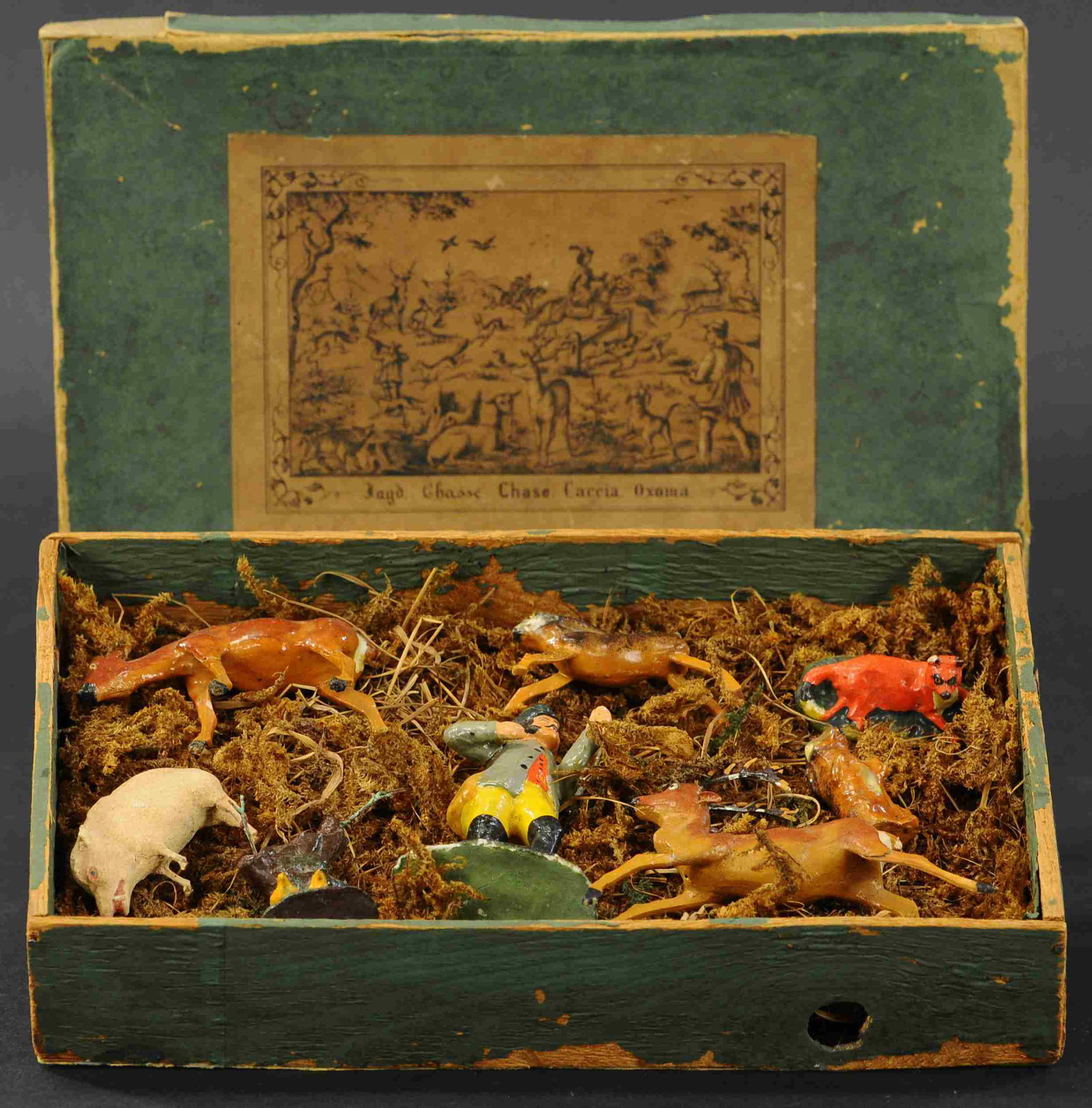 THURINGIAN WOODSMAN HUNT SCENE: 508. THURINGIAN WOODSMAN HUNT SCENE | Early German Putz figures, original wooden/card box, 6 pieces. | 80mm | Figures (Very Good Condition), box in rough condition. | $200 - $400