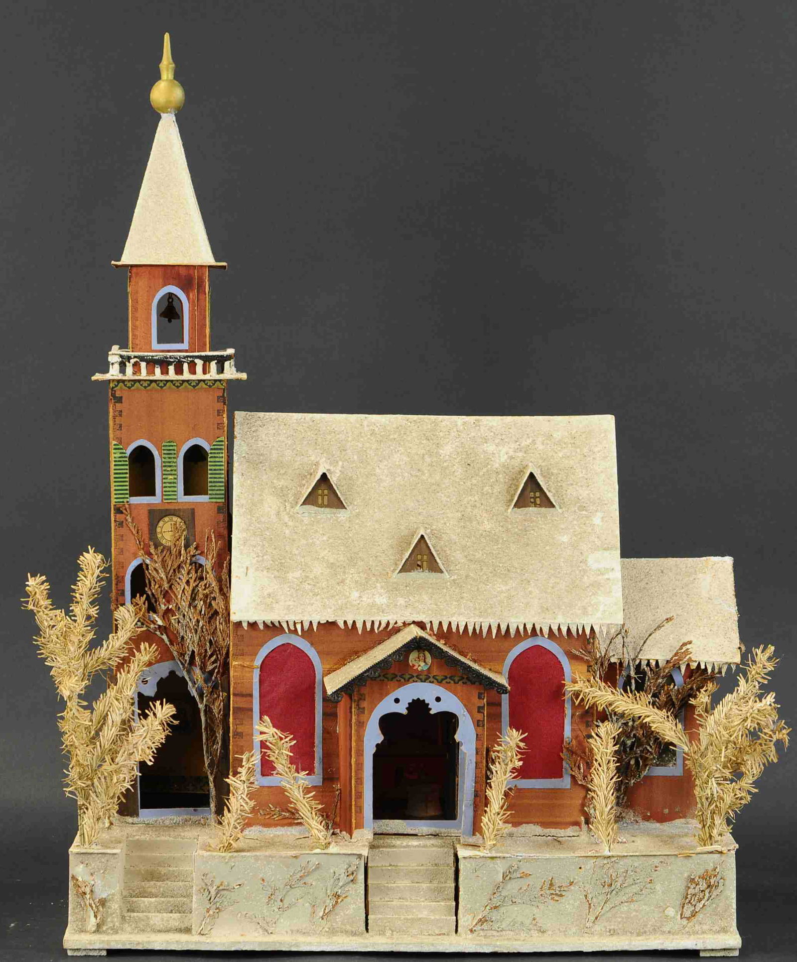 SPLENDID CANDLE-LIT CHRISTMAS PUTZ CHURCH: 519. SPLENDID CANDLE-LIT CHRISTMAS PUTZ CHURCH | A formidable size building of pressed and formed cardboard on wood, crushed glass snow covered and with interior fixtures, candle holders for lighting,