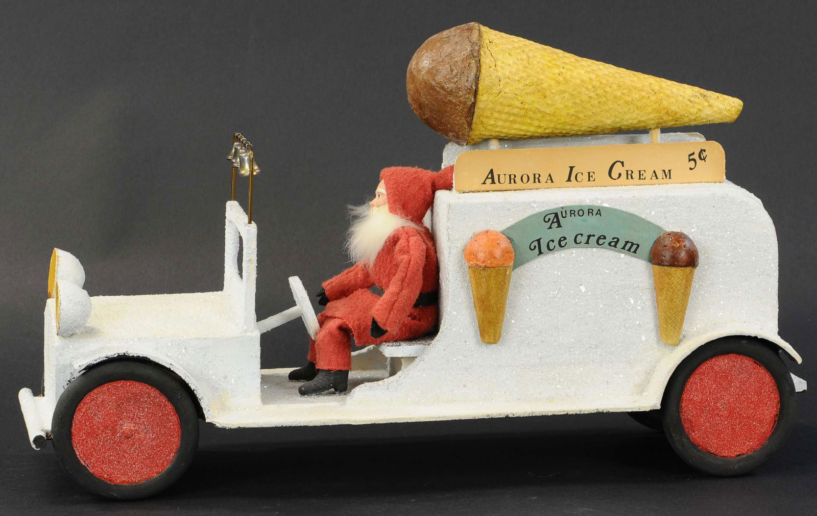 SANTA: 537. SANTA'S ICE CREAM DELIVERY TRUCK STORE DISPLAY | Every child's dream of Santa delivering ice cream, 1940's store display trade piece label on bottom "Merchants Display & Novelty Corp." | 19" leng