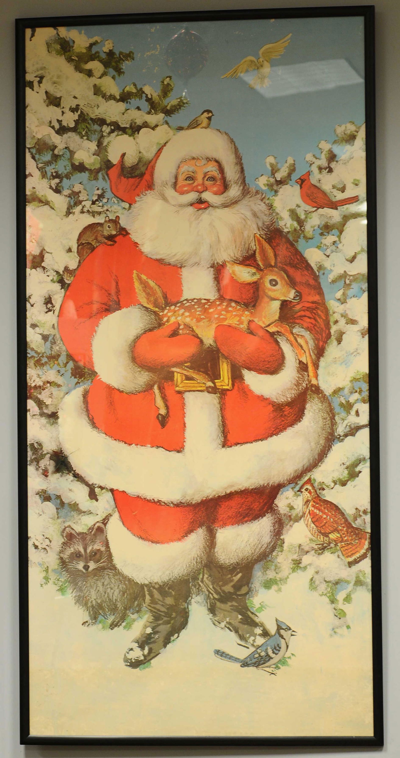 LIFE SIZE SANTA POSTER: 556. LIFE SIZE SANTA POSTER | A paternal looking Santa Claus with woodland animals from approximately 1960's-1970's ??, done on heavy paper and framed in Plexiglas. | 6' height. | (Very Good to Excell