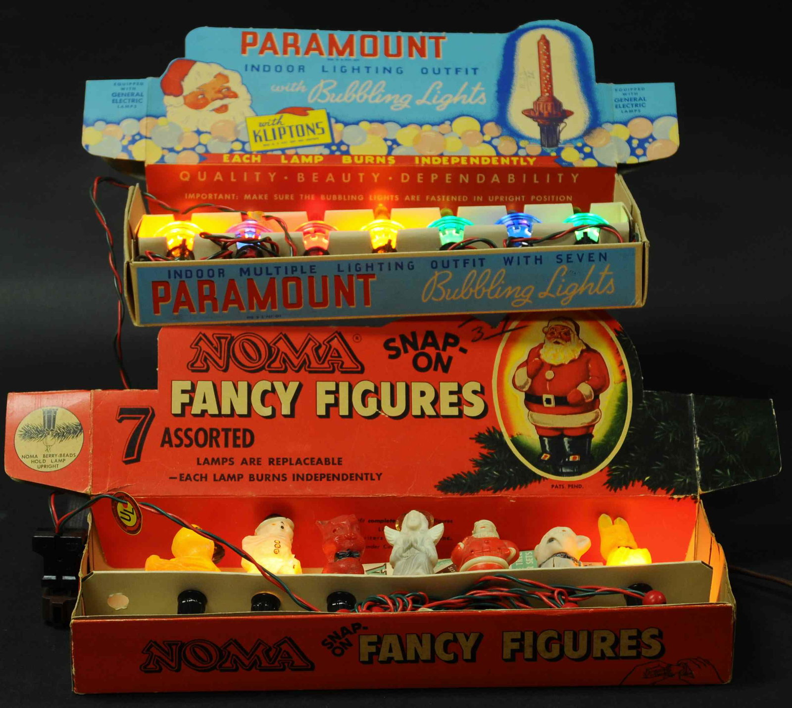 TWO BOXED VINTAGE LIGHT SETS: 587. TWO BOXED VINTAGE LIGHT SETS | Noma Fancy Figures light set featuring Santa, angel, snowman and animals, and Paramount Bubbling Lights set with kliptons. | Larger box 6.5" wide x 17" length. | (E