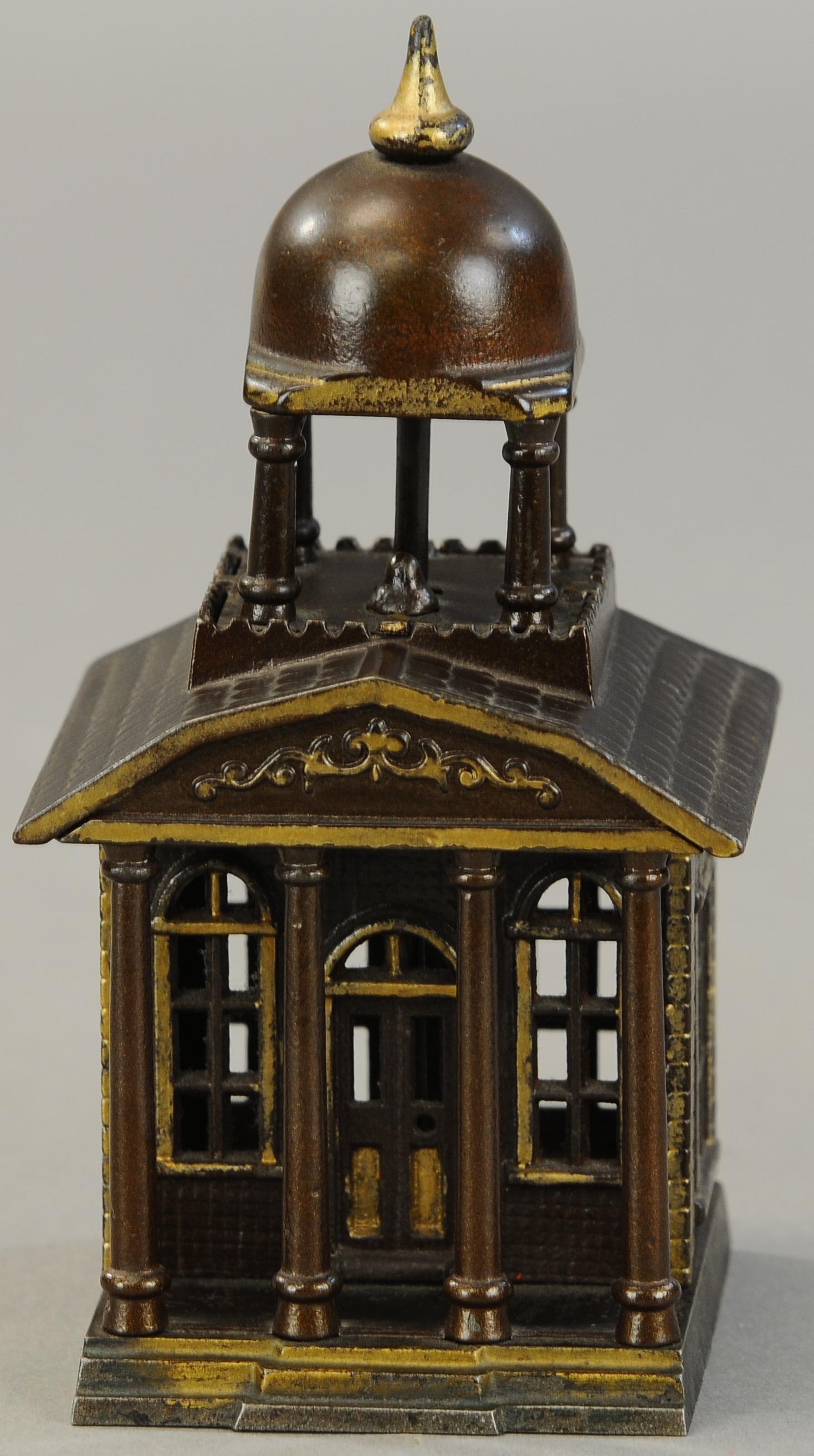 BUILDING WITH BELFRY STILL BANK: 97. BUILDING WITH BELFRY STILL BANK | Attributed to Kenton, visually great architecturally and seldom found with no flaws or cracks. 8" h. | No breaks or cracks detected, all original in (Exc. Cond.) 