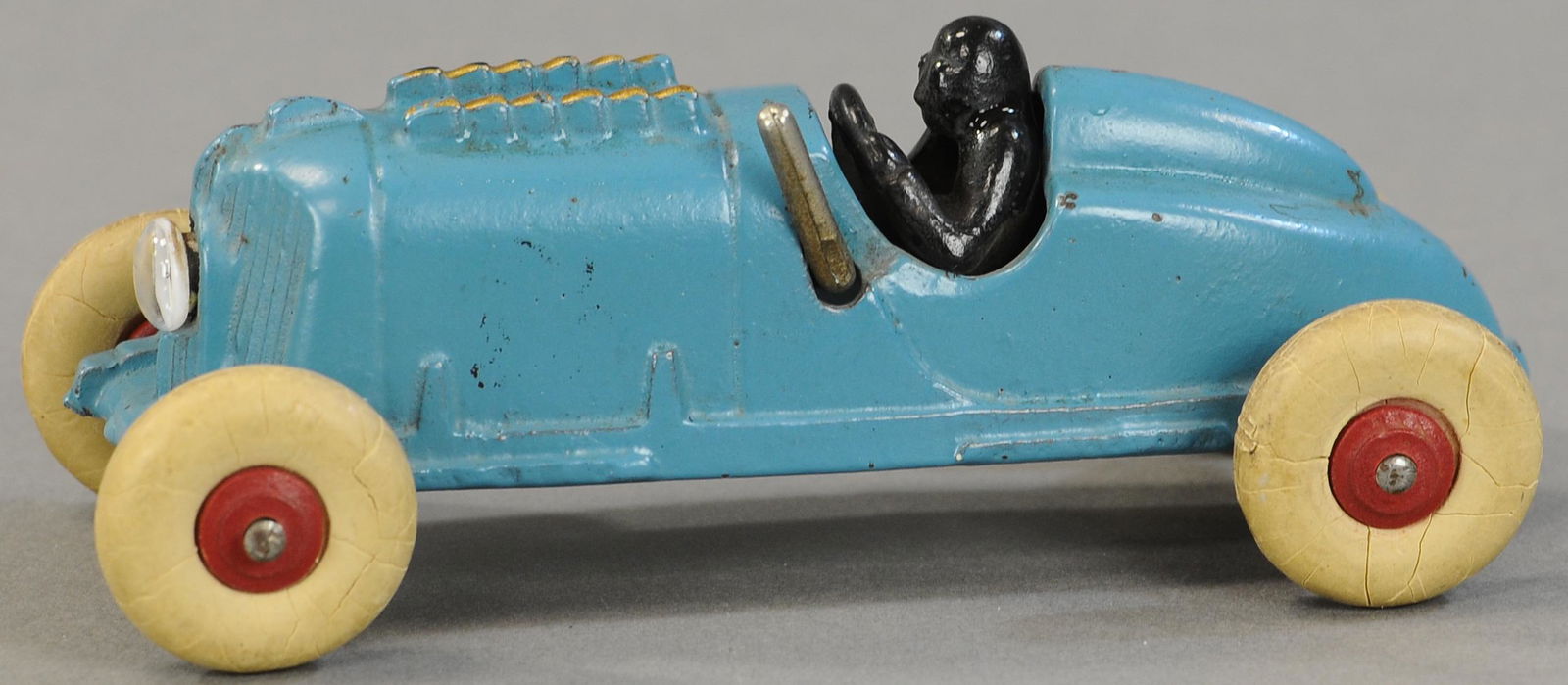 HUBLEY RACER WITH HEADLIGHT: 230. HUBLEY RACER WITH HEADLIGHT | Very hard to find with original lever and battery holder. 6.5" l. | (Pristine Cond.) | $300 - $500