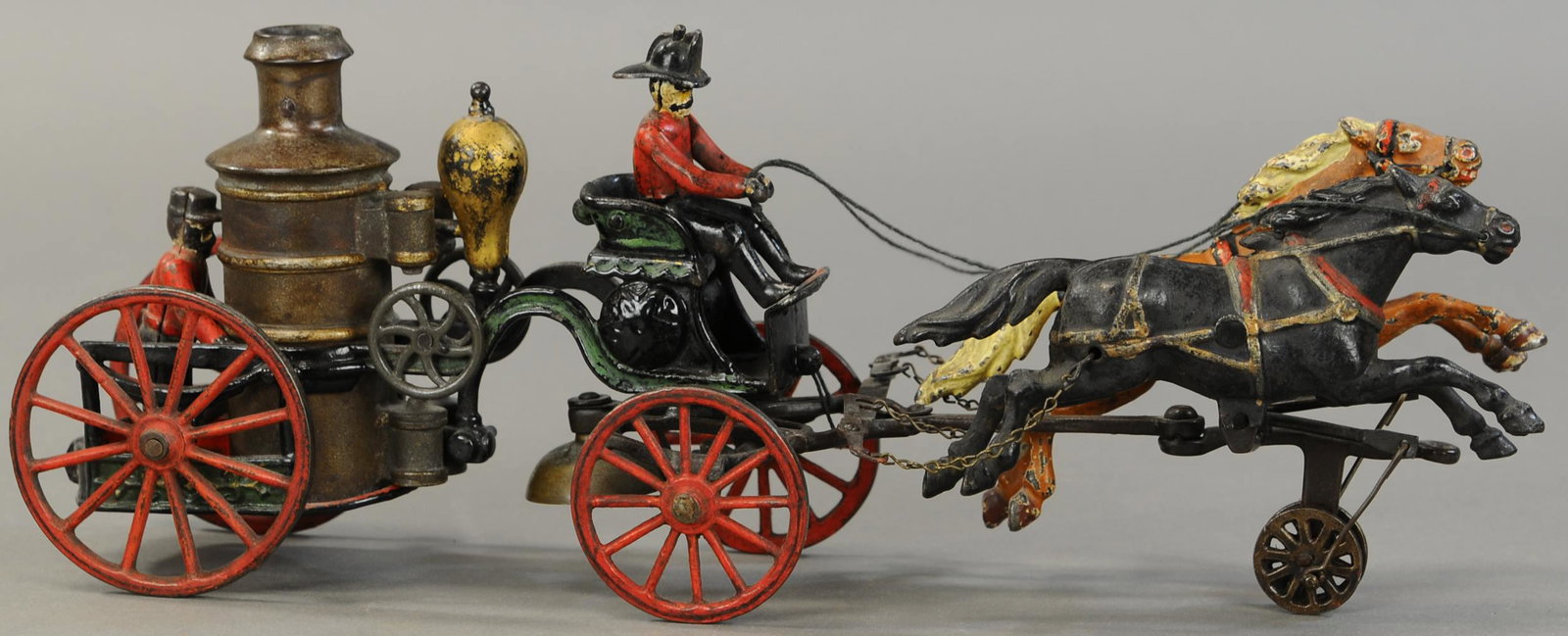 PRATT & LETCHWORTH HORSE DRAWN FIRE PUMPER: 321. PRATT & LETCHWORTH HORSE DRAWN FIRE PUMPER | 18" l. | Rear figure is replaced, otherwise in (VG Cond.) | $1,200 - $1,600