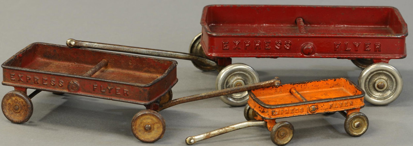 THREE KILGORE EXPRESS WAGONS: 428. THREE KILGORE EXPRESS WAGONS | Lot includes three sizes; small, medium, and large. 4" - 7" l. | Overall (VG-Exc. Cond.) | $200 - $400
