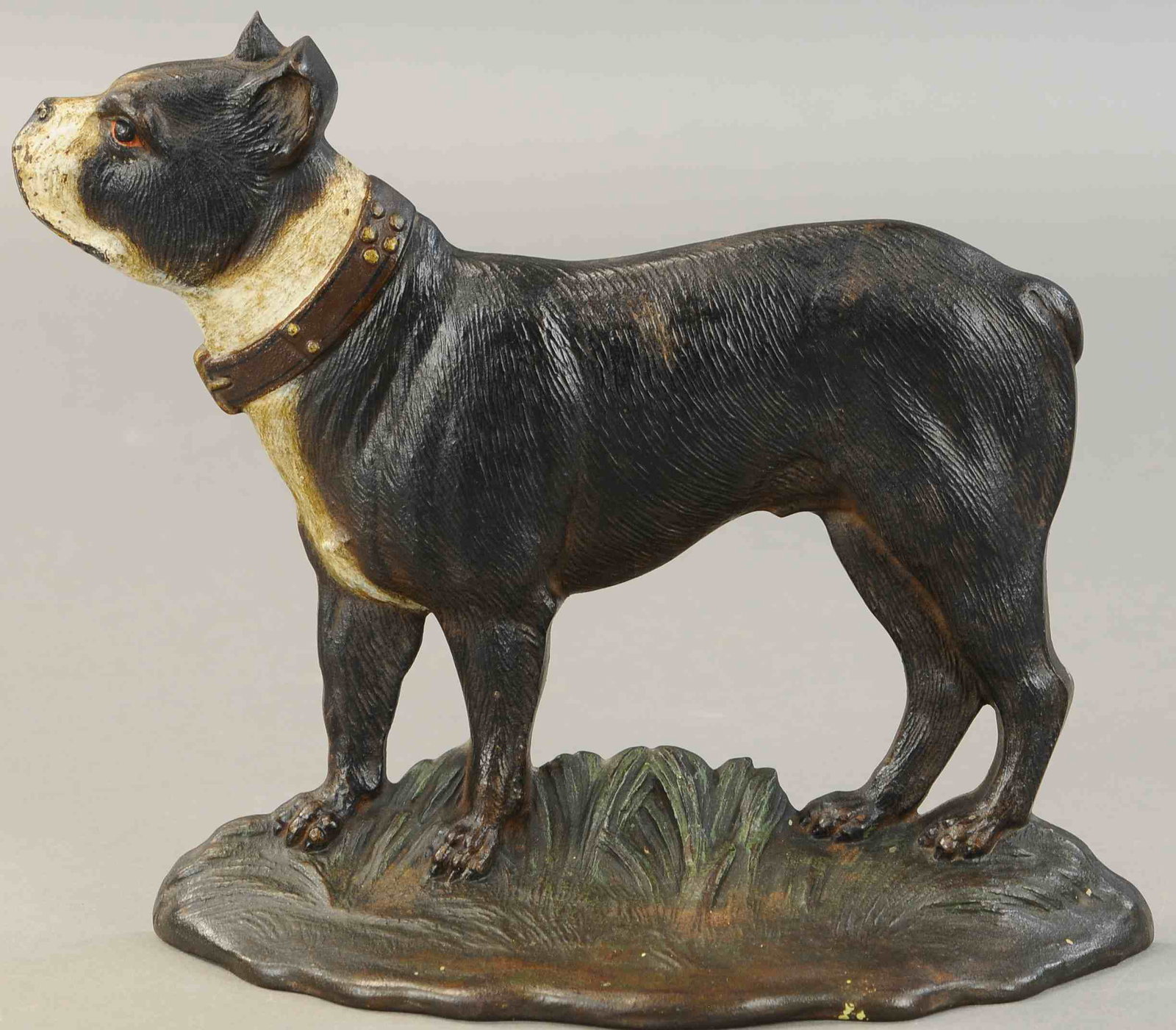 B&H BOSTON TERRIER STANDING DOORSTOP: 455. B&H BOSTON TERRIER STANDING DOORSTOP | "Dandy," dark brown coloring, depicts side view of proud terrier wearing a collar and standing in grass. 11" l. | (VG-Exc. Cond.) | $200 - $400