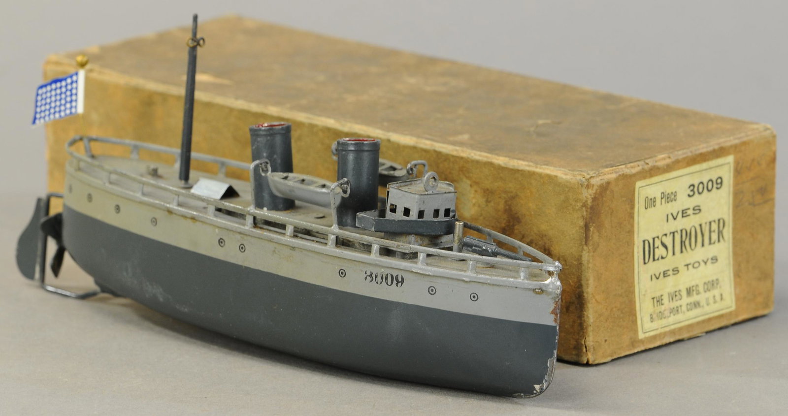 BOXED IVES DESTROYER BATTLESHIP: 503. BOXED IVES DESTROYER BATTLESHIP | Hard to find in this quality of condition as these boats are often flaked. 11"l. | One mast missing, All original, very hard to find. (Exc-Pristine Cond. for thi