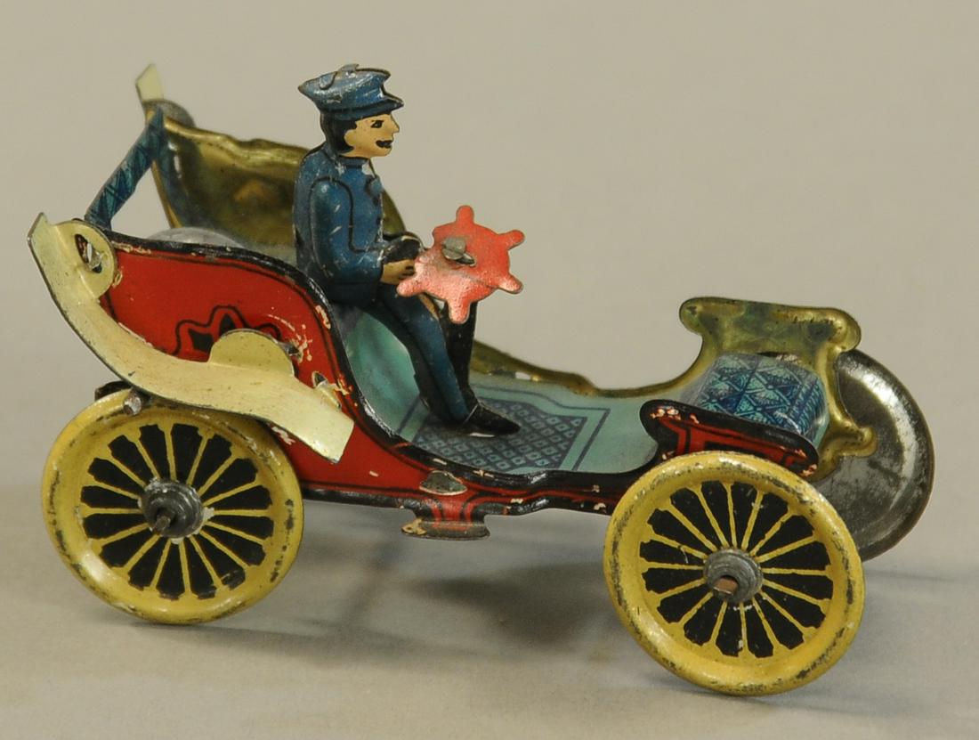 EARLY GERMAN RUNABOUT FLYWHEEL PENNY TOY: 1041. EARLY GERMAN RUNABOUT FLYWHEEL PENNY TOY | Cute little car with nice lithography. 3" l. | (Pristine Cond.) | $300 - $500