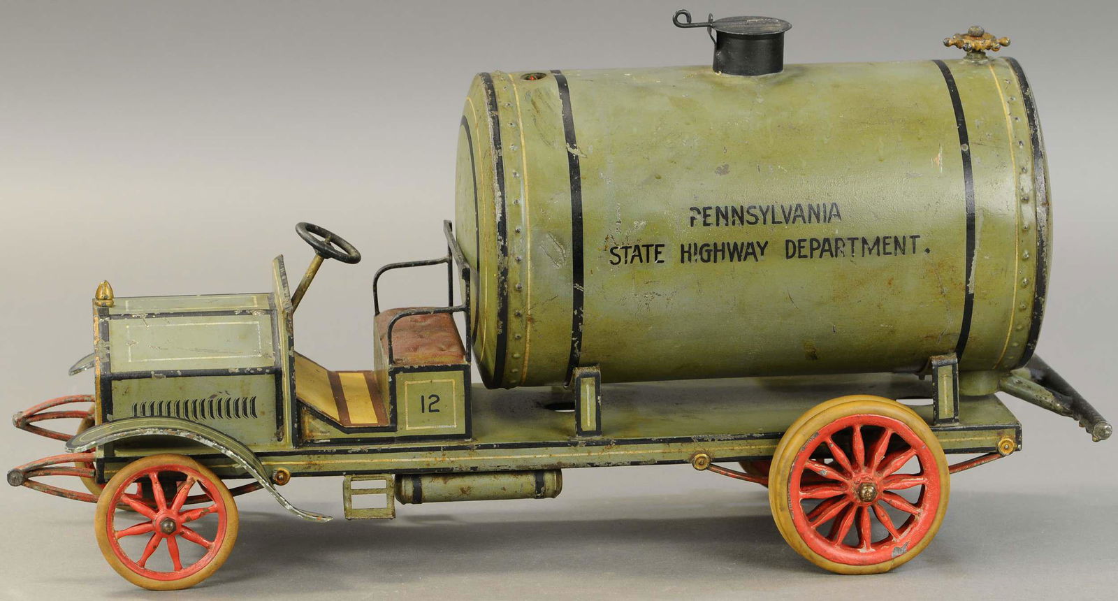 LARGE MARKLIN WATER TANK TRUCK: 1069. LARGE MARKLIN WATER TANK TRUCK | Large scale auto with fine details, lid at top of water tank allows filling for rear sprinkler bar to wet the street as it travels, marked "Pennsylvania State Hi