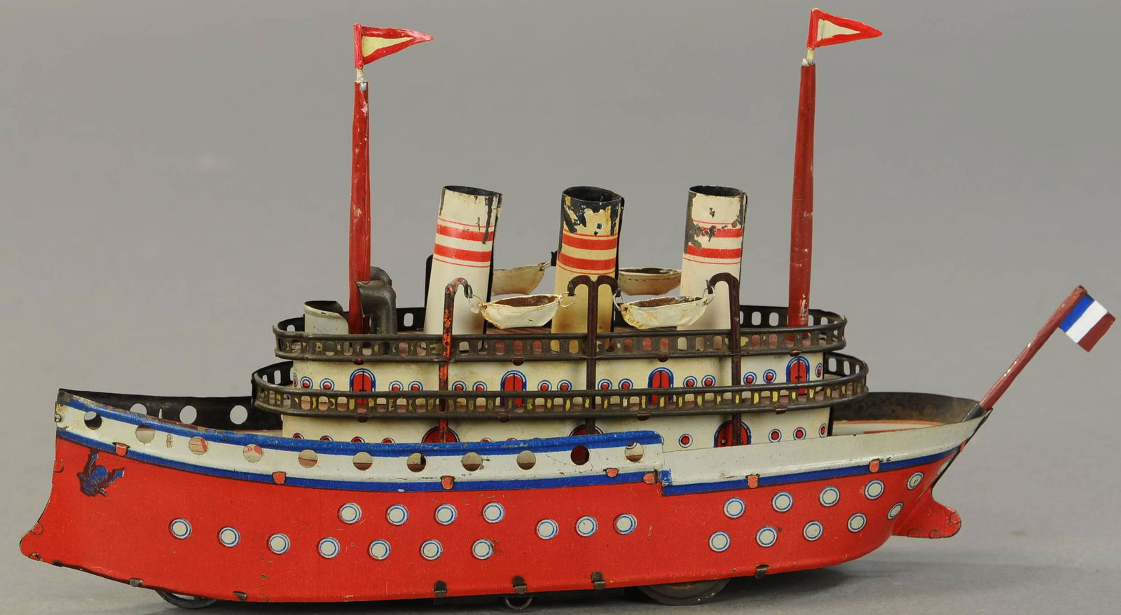 OROBR WIND-UP OCEAN LINER: 1091. OROBR WIND-UP OCEAN LINER | 11" l. | Masts, flags and lifeboats are replacements, otherwise original in (VG Cond.) | $300 - $500