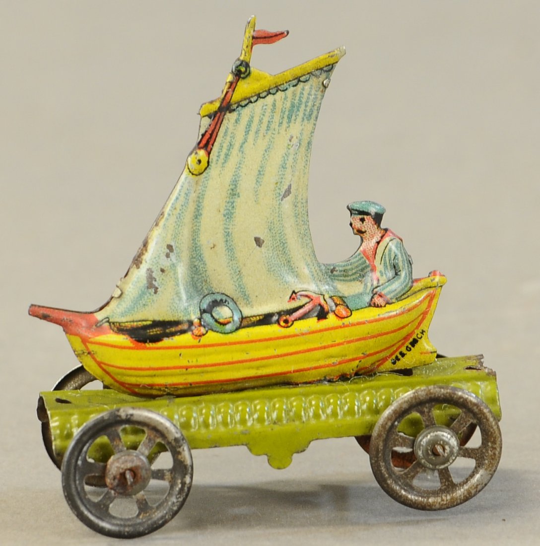 MAN IN SAILBOAT PENNY TOY: 1122. MAN IN SAILBOAT PENNY TOY | 3.25" h. | Oxidation to back edge, otherwise in (Exc. - Pristine Cond.) | $400 - $600