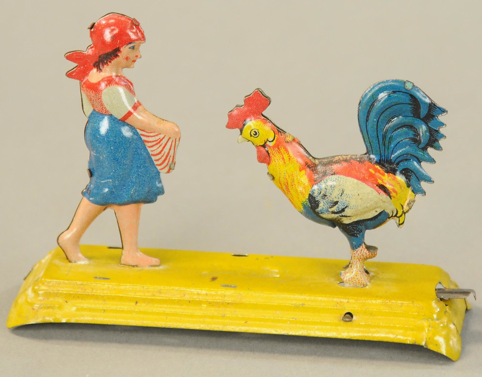 MEIER GIRL FEEDING CHICKEN PENNY TOY: 1137. MEIER GIRL FEEDING CHICKEN PENNY TOY | 4" l. | (Exc - Pristine Cond.) | $300 - $400
