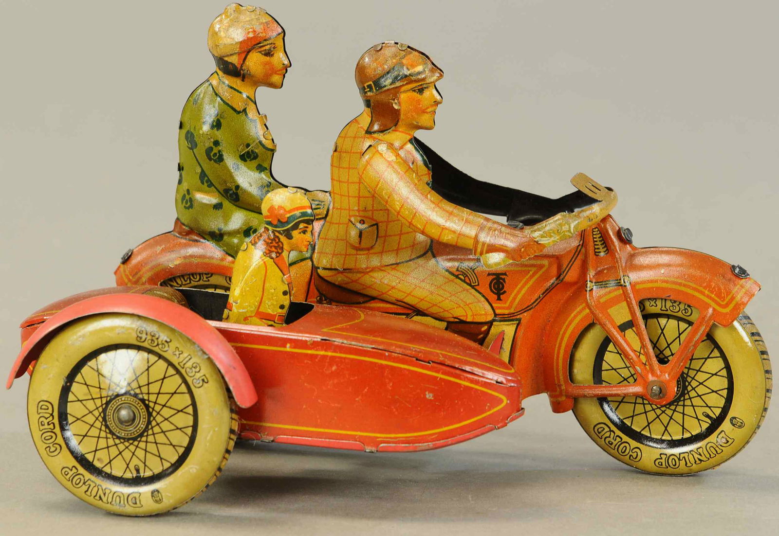 TIPPCO FAMILY CYCLE W/SIDECAR: 1170. TIPPCO FAMILY CYCLE W/SIDECAR | Nice color variation, rare and desirable bike with a great form and very detailed embossed lithography, bright lithography on this example. 10" l. | Red fender on