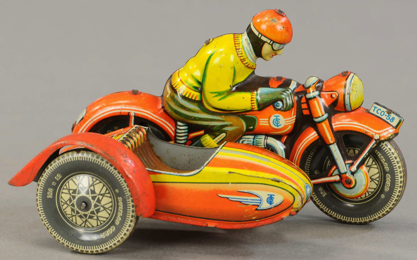 TIPPCO RACING CYCLE W/ SIDECAR: 1229. TIPPCO RACING CYCLE W/ SIDECAR | Scarce example. 6.5" l. | (VG - Exc Cond.) | $500 - $750