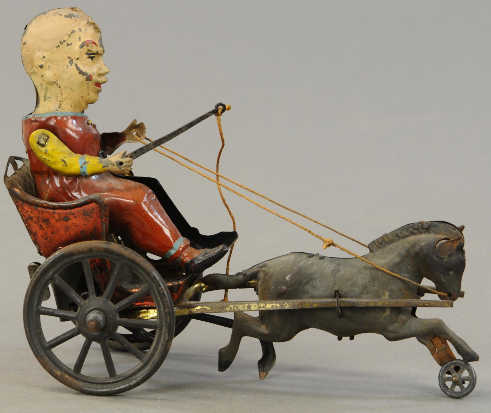CLOWN RIDING PONY CART: 1255. CLOWN RIDING PONY CART | 8" l. | Touch up to head of toy, one repainted arm, otherwise in (VG - Exc. Cond.) | $300 - $500