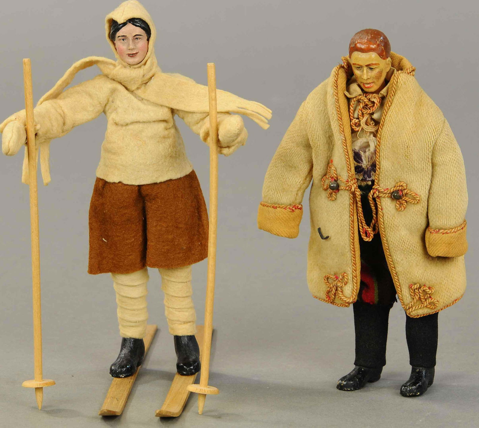 BUCHERER SABA LAPLANDER MAN & WOMAN FIGURES: 1356. BUCHERER SABA LAPLANDER MAN & WOMAN FIGURES | A. Bucherer & Cie, Switzerland, circa 1925, 2 metal fully jointed figures with composition heads, hands and molded shoes, both with original winter