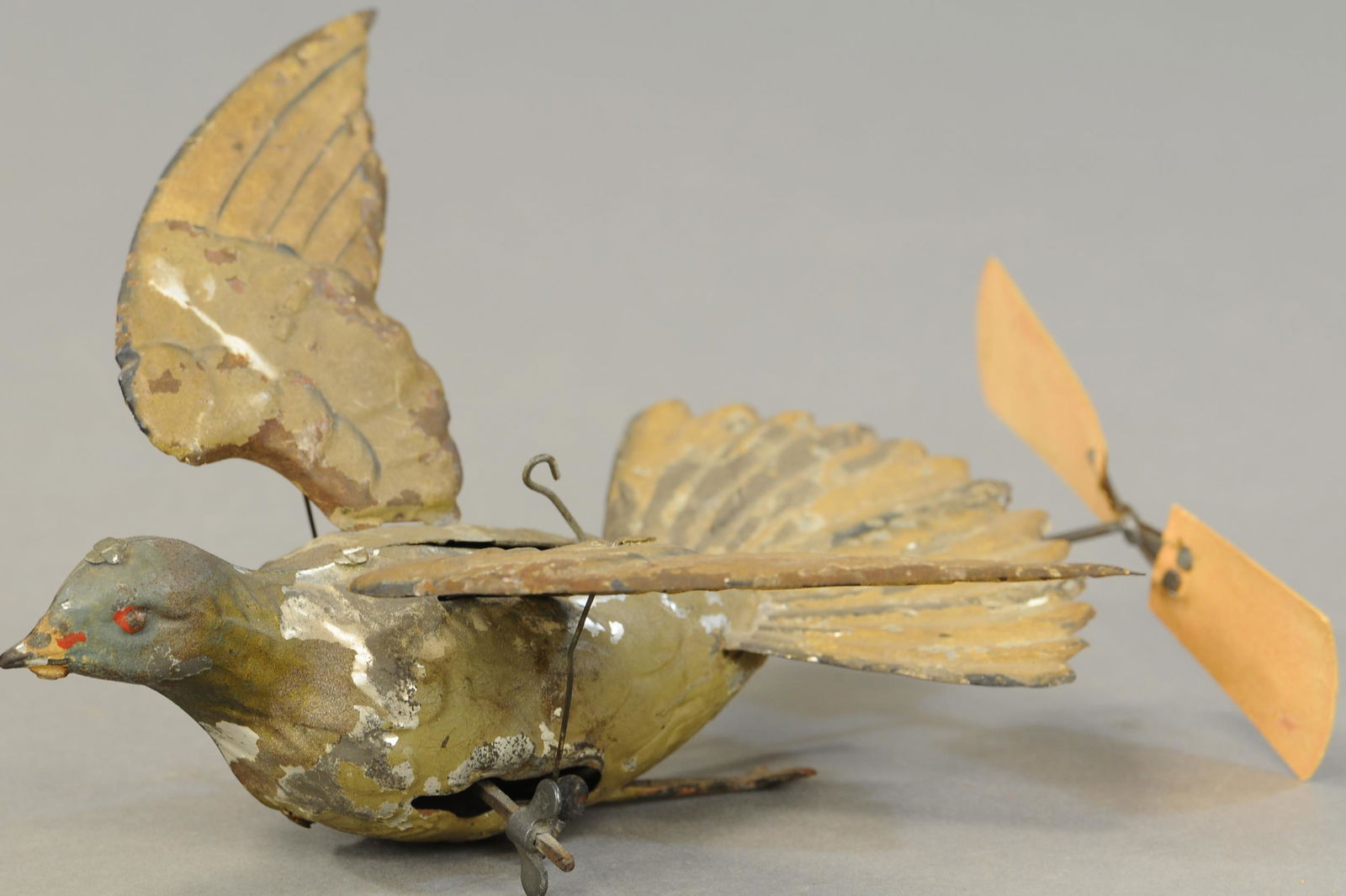 GUNTHERMANN FLYING PIGEON W/ PROPELLER: 1375. GUNTHERMANN FLYING PIGEON W/ PROPELLER | Germany, wind-up spins the propeller and flaps the birds wings causing it to seemingly fly in a circle, when hung by string. 10 " | (VG Cond.) | $400 - $