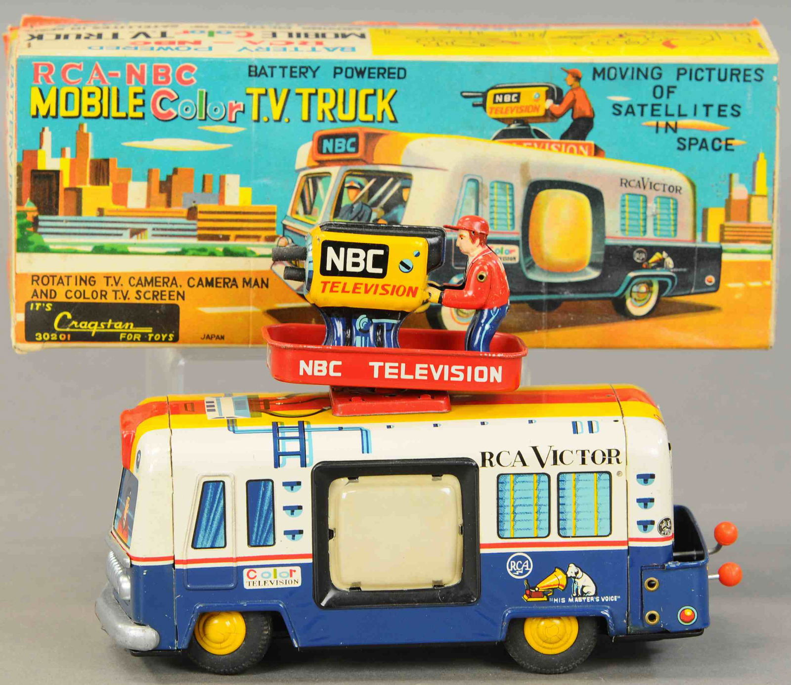 CRAGSTAN MOBILE COLOR TV TRUCK: 1392. CRAGSTAN MOBILE COLOR TV TRUCK | Japan, battery operated, desirable example, original removable cameraman on top, levers at rear, working tv screen on side. 9" l. | Box is (Exc. Cond.), Toy is i