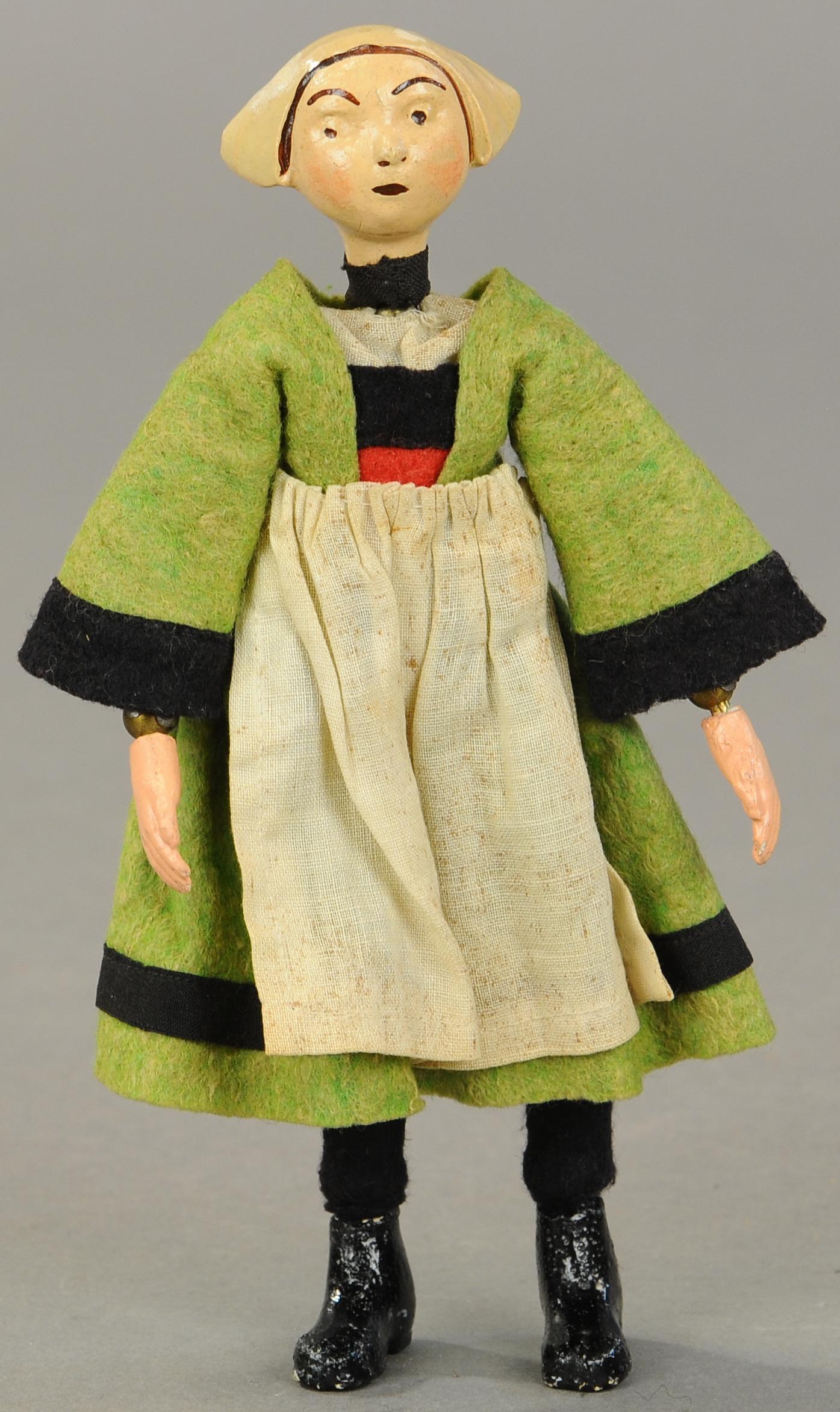 BUCHERER SABA COMIC CHARACTER BECASSINE FIGURE: 1413. BUCHERER SABA COMIC CHARACTER BECASSINE FIGURE | A. Bucherer & Cie, Switzerland, circa 1925, metal fully jointed figure with composition head, hands and molded shoes, of the famous French charac