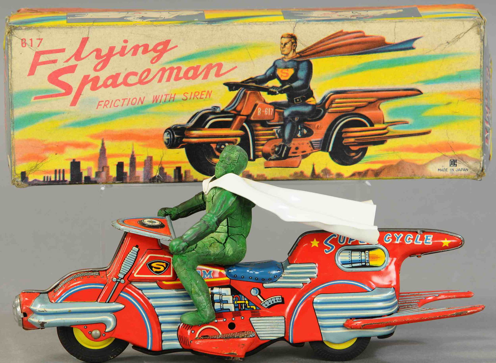BOXED BANDAI FLYING SPACEMAN SUPERMAN MOTORCYCLE: 1521. BOXED BANDAI FLYING SPACEMAN SUPERMAN MOTORCYCLE | Extremely rare example, beautiful lithography covers all sides of this flying motorcycle and is matched in detail by that of the original box l